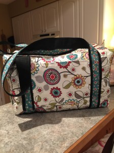the back of the bag showing the sleeve Carry -on Duffle